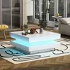 A modern living room with a white coffee table with LED lighting. Podgląd zdjęcia produktu