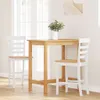 A wooden bar table with two white bar stools in a bright room with a window. Náhled obrázku produktu