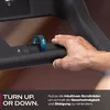 A hand is shown adjusting a dial on a treadmill. Produktbild-Vorschau