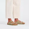 A person wearing Birkenstock Arizona sandals. Produktbild-Vorschau