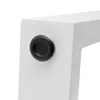 A close-up view of a white furniture leg with a black rubber foot. Podgląd zdjęcia produktu