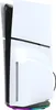 A white gaming console with a black interior, standing vertically on a black base with RGB lighting. Podgląd zdjęcia produktu