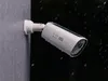 A white eufy S330 eufyCam 4K security camera is mounted on a gray wall, with raindrops falling around it. Náhľad obrázku produktu