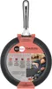 A frying pan with packaging and marketing information. Produktbild-Vorschau