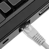 A close-up shot of an Ethernet cable being plugged into a laptop's port. Náhled obrázku produktu