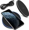 A black wireless charger with a phone on it, and a charging cable. Produktbild-Vorschau