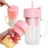 A hand holding a portable blender with fruit inside, and another blender with a straw on a white background. Produktbild-Vorschau