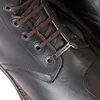 Close-up of the lacing area of a brown leather boot. Podgląd zdjęcia produktu