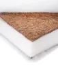 A close-up, angled view of a cross-section of a baby mattress, showing its layered construction. Produktbild-Vorschau
