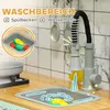 A close-up view of a toy kitchen sink area with a faucet, sink, and toy food items. Produktbild-Vorschau
