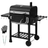 A black charcoal grill with accessories on a white background. Produktbild-Vorschau