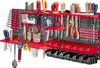 A well-organized tool wall with various tools neatly arranged on red and gray pegboards. Podgląd zdjęcia produktu