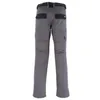 A back view of grey work pants with black accents. Produktbild-Vorschau