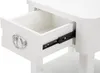 A close-up view of an open drawer on a white nightstand, showing the drawer slides. Náhled obrázku produktu