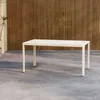 A beige rectangular table with four legs is placed on a concrete floor in front of a wooden slatted wall. Podgląd zdjęcia produktu