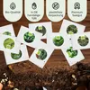 A collection of seed packets arranged on a wooden surface with soil and gardening tools. Náhled obrázku produktu