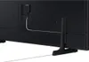 The back of a black television with a stand and a white cable attached. Voir les images du produit