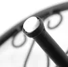 A close-up view of a black metal stand with a white cap on top. Produktbild-Vorschau
