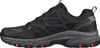 Side view of a black and gray athletic shoe. Produktbild-Vorschau