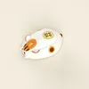 A computer mouse designed to look like a cat with orange and brown markings, on a light background. Náhled obrázku produktu