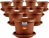 A collection of terracotta-colored plant pots with saucers, arranged in a tiered display. Produktbild-Vorschau