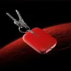 A red keychain with two keys attached, set against a dark background with a red, textured surface resembling a planet's surface. Náhled obrázku produktu