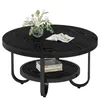 A black, round coffee table with two tiers and a vase of flowers and a magazine on the top surface. Produktbild-Vorschau