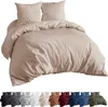 A taupe colored duvet cover and pillow set is displayed against a white background. Below the main product image, a row of smaller images shows the same bedding set in various colors. Produktbild-Vorschau