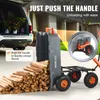 A garden cart is shown unloading a pile of firewood next to a car. Anteprima dell’immagine prodotto
