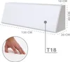 A white wedge-shaped foam product with dimensions indicated by text and lines, and a hand touching the surface in a circular inset. Produktbild-Vorschau