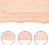 A close-up view of a light brown wooden shelf with a natural, wavy edge, shown against a white background. Three circular insets provide magnified views of the shelf's edge. Náhled obrázku produktu