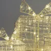 A close-up view of illuminated decorative gift boxes. Produktbild-Vorschau