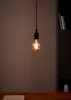 A single light bulb hanging from a cord against a dark background. Náhľad obrázku produktu