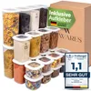 A collection of clear plastic food storage containers filled with various dry goods, arranged in front of a cardboard box. Anteprima dell’immagine prodotto
