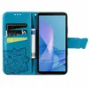 A teal flip-style phone case with a floral embossed design is shown open, displaying card slots and a phone inserted. Produktbild-Vorschau