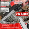 A person is holding a portable electric pruning saw, with logs in the background. Produktbild-Vorschau