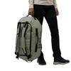 A person holding a duffel bag. Produktbild-Vorschau
