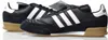 A pair of black Adidas sneakers with white stripes and tan soles are shown against a white background. Náhled obrázku produktu