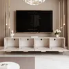 A modern living room with a TV stand and television. Voir les images du produit