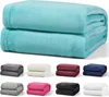 A stack of folded blankets in various colors, with a larger stack of teal blankets at the top. Produktbild-Vorschau