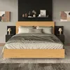 A bedroom scene featuring a bed with nightstands and artwork. Podgląd zdjęcia produktu