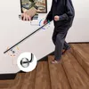 An elderly person is using a stainless steel handrail to go down a wooden staircase. Produktbild-Vorschau