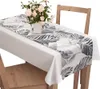 Vzorovaný behúň na stôl 40x140 cm veľké listy šedý Náhľad obrázku produktu 1