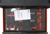 A top-down view of a tool drawer insert filled with various tools, including screwdrivers and pliers. A document is placed on top of the tools. Produktbild-Vorschau