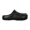A single black clog shoe shown from the side against a white background. Produktbild-Vorschau