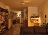 A living room with a bookshelf, a desk, and a sofa. Anteprima dell’immagine prodotto