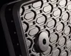 A close-up view of a textured surface with a hexagonal pattern and a circular fastener. Produktbild-Vorschau