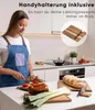 A woman is preparing food in a kitchen, with a set of cutting boards and bread on the counter. Náhled obrázku produktu