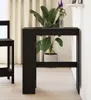 A black bar table with a plant on it, placed next to a chair in a room with light-colored curtains and flooring. Podgląd zdjęcia produktu