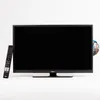 A television with a remote control and a DVD inserted. Produktbild-Vorschau
